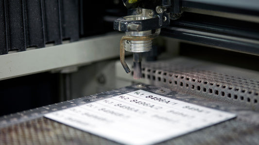 Laser engraved acrylic asset labels and electrical panel labels on a laser engraved bed