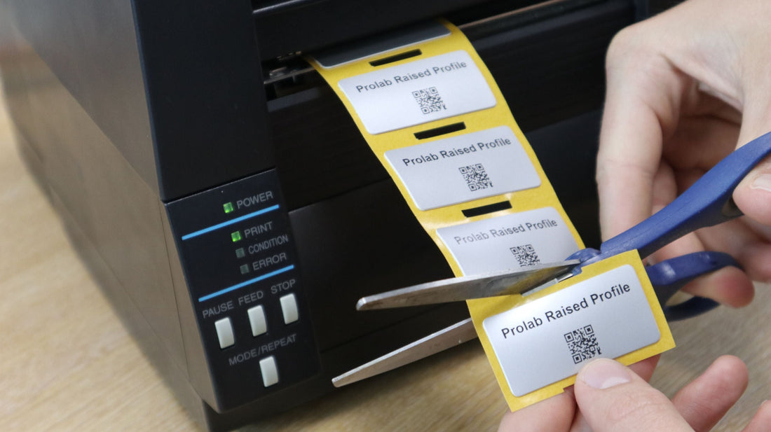 Prolab asset labels coming out of the Fox-in-a-Box Thermal Transfer Label Printer