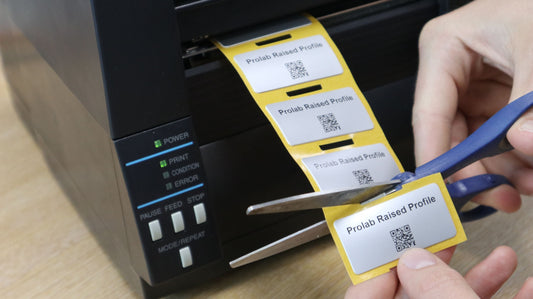 Prolab asset labels coming out of the Fox-in-a-Box Thermal Transfer Label Printer